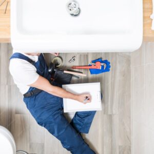 plumber-lying-writing-tablet_23-2147772224